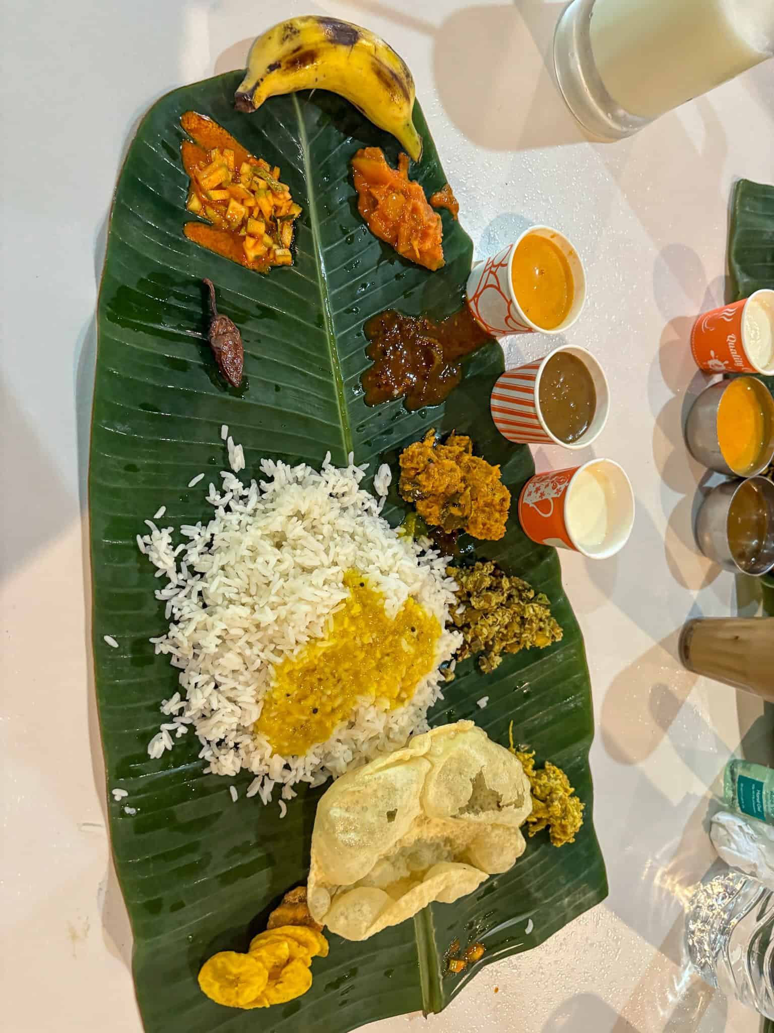 Traditional Keralan lunch of Sadhya on banana leaf