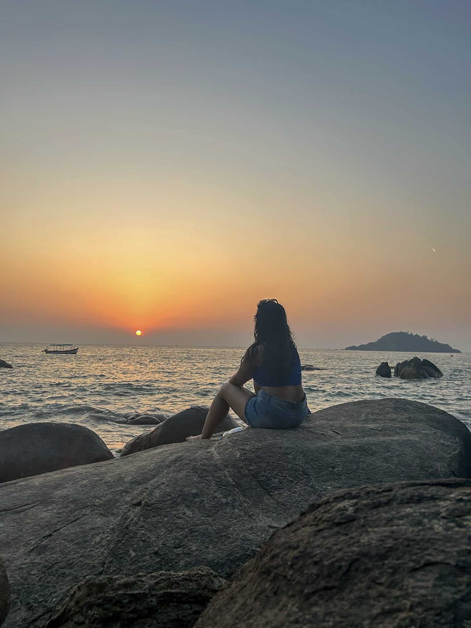 Poorva on the rocks at Palolem beach in South Goa at sunset