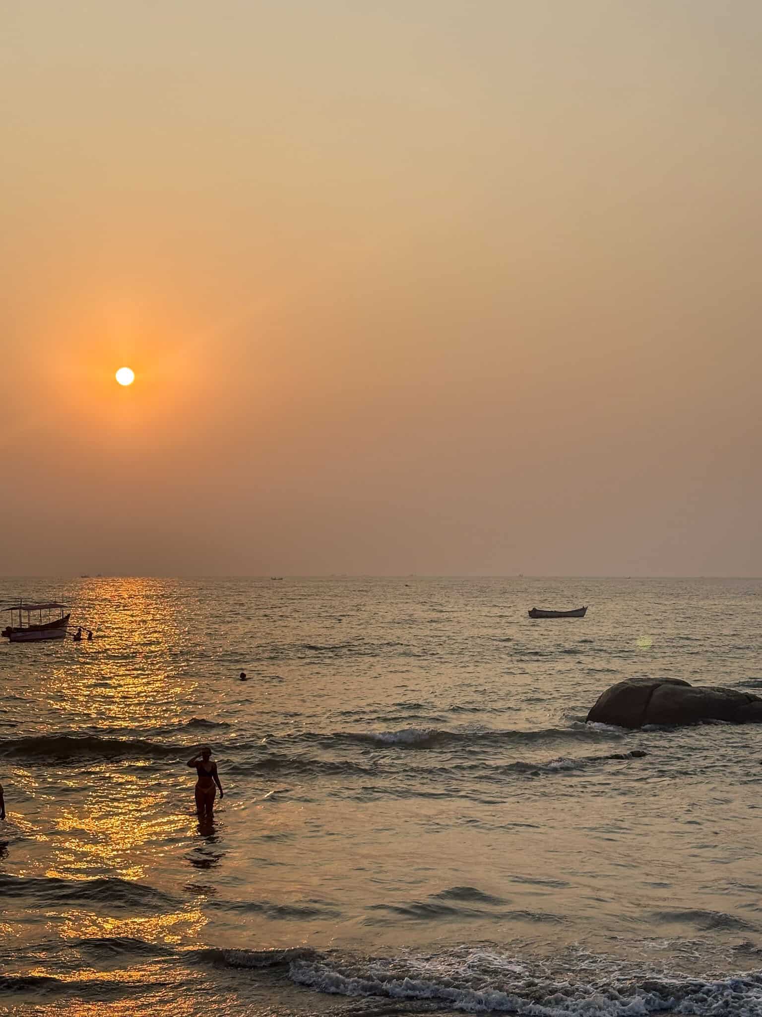 Poorva at sunset from the rocks at the end of Palolem Beach
